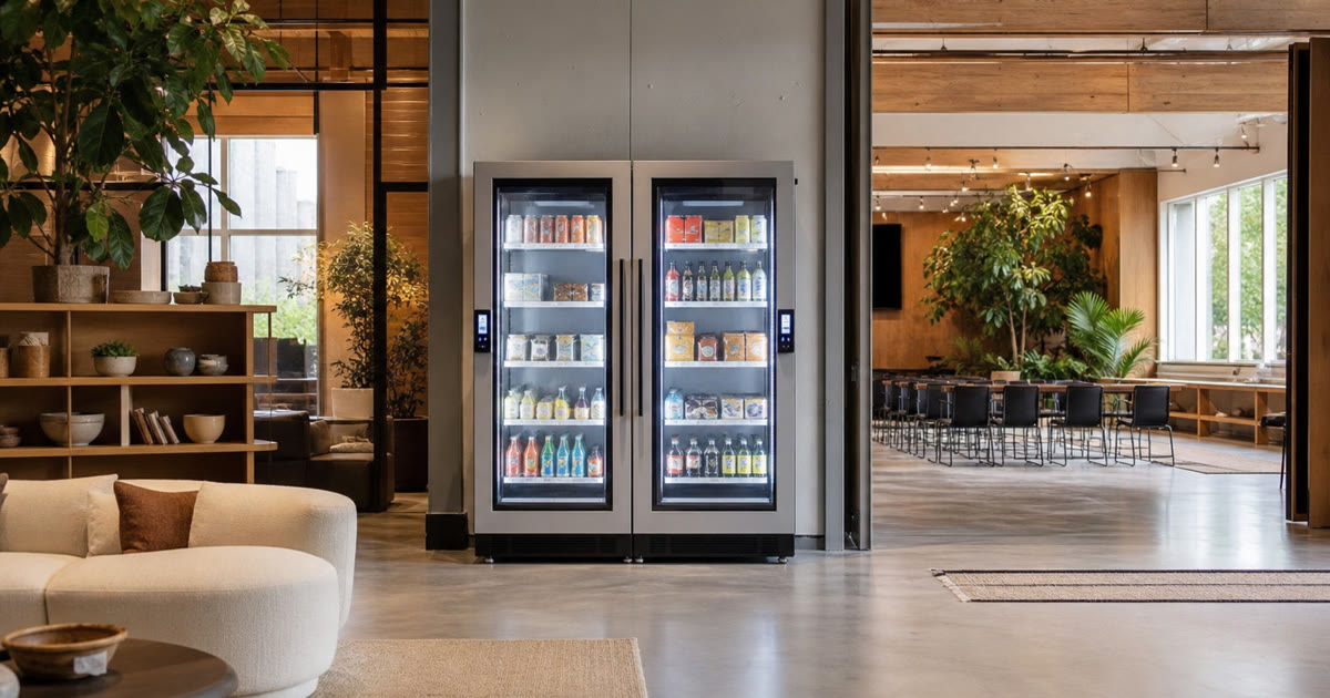 Revvolto smart cooler pair in an Austin retail campus lounge with clear glass doors and handle touch panels
