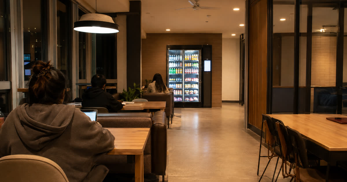 Revvolto smart vending machine in an Austin student housing study lounge with clear stocked glass