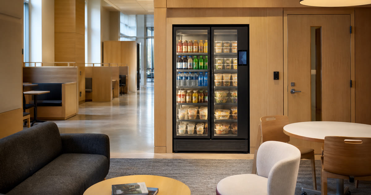 Revvolto smart cooler in an Austin campus lounge with stocked clear glass doors and service access
